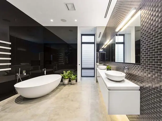 Bathroom with free standing bathrub and basin sinks